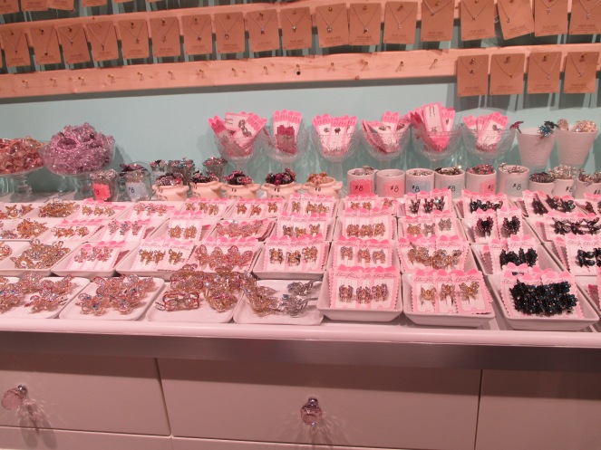 A table of very sparkly, shiny hair accessories.
