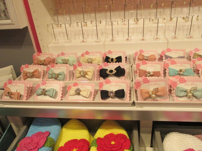 More hair accessories and some jewelry. This shelf is directly right of the entrance to the store.